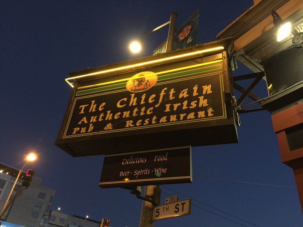 a sign lit up at night