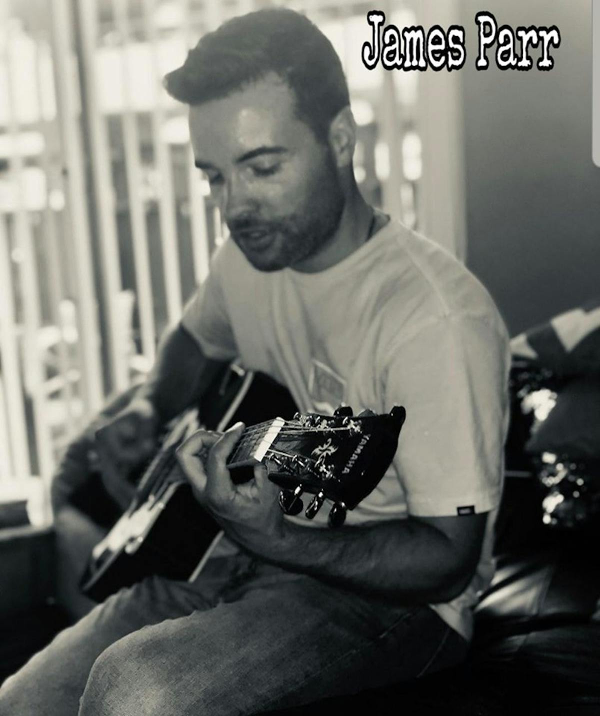 a man holding a guitar