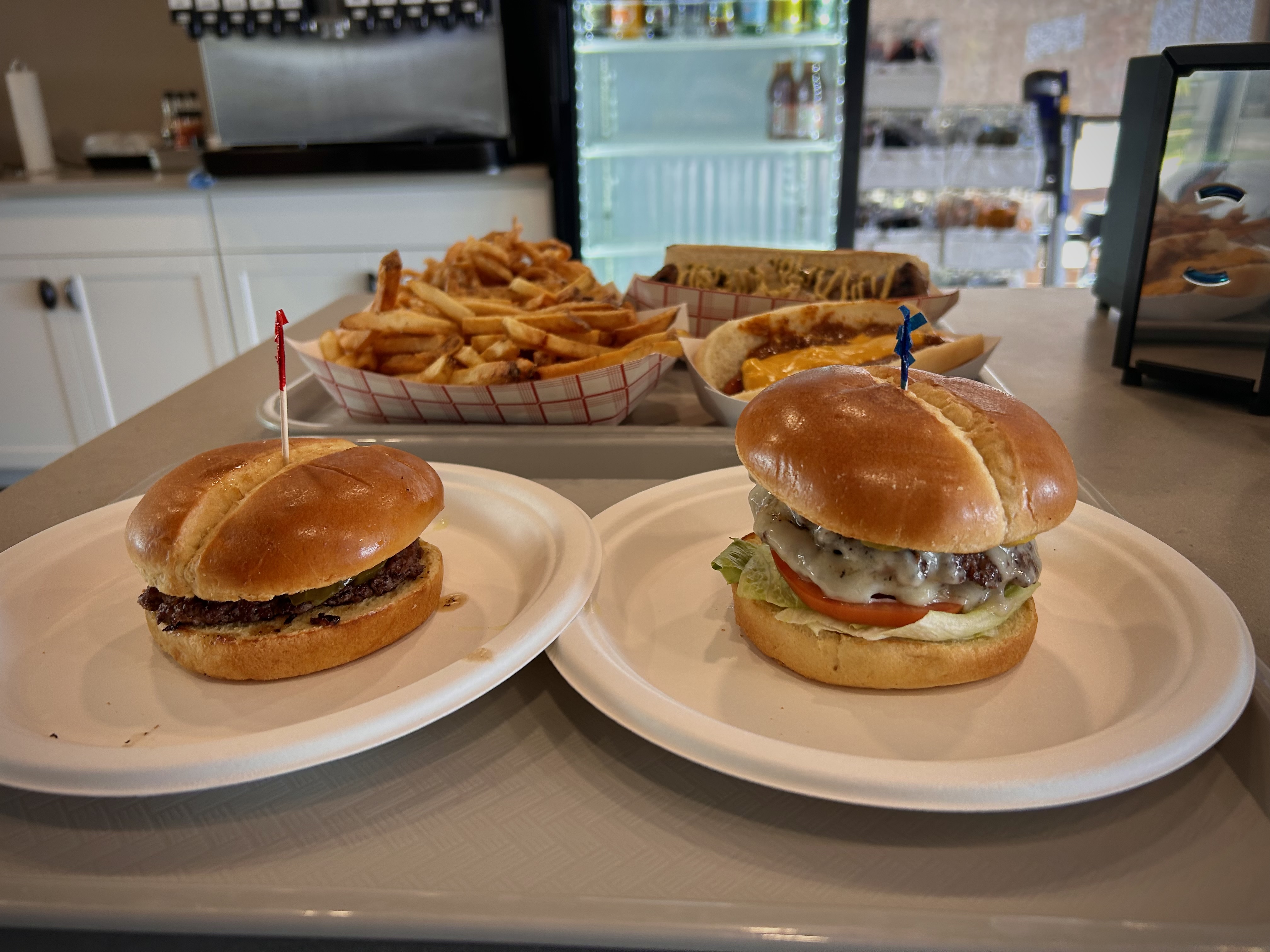 a sandwich sitting on top of a plate of food on a table