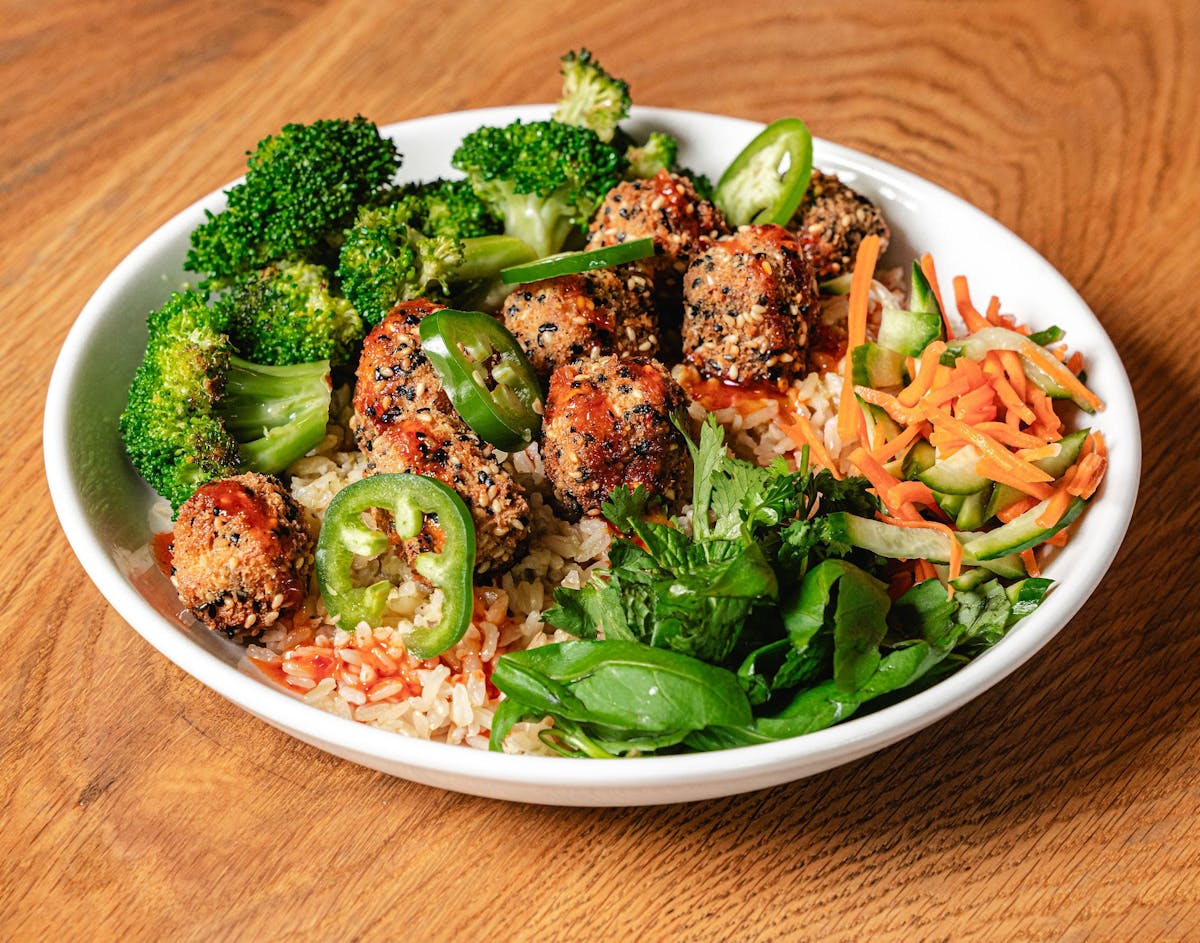 a bowl filled with different types of food on a table