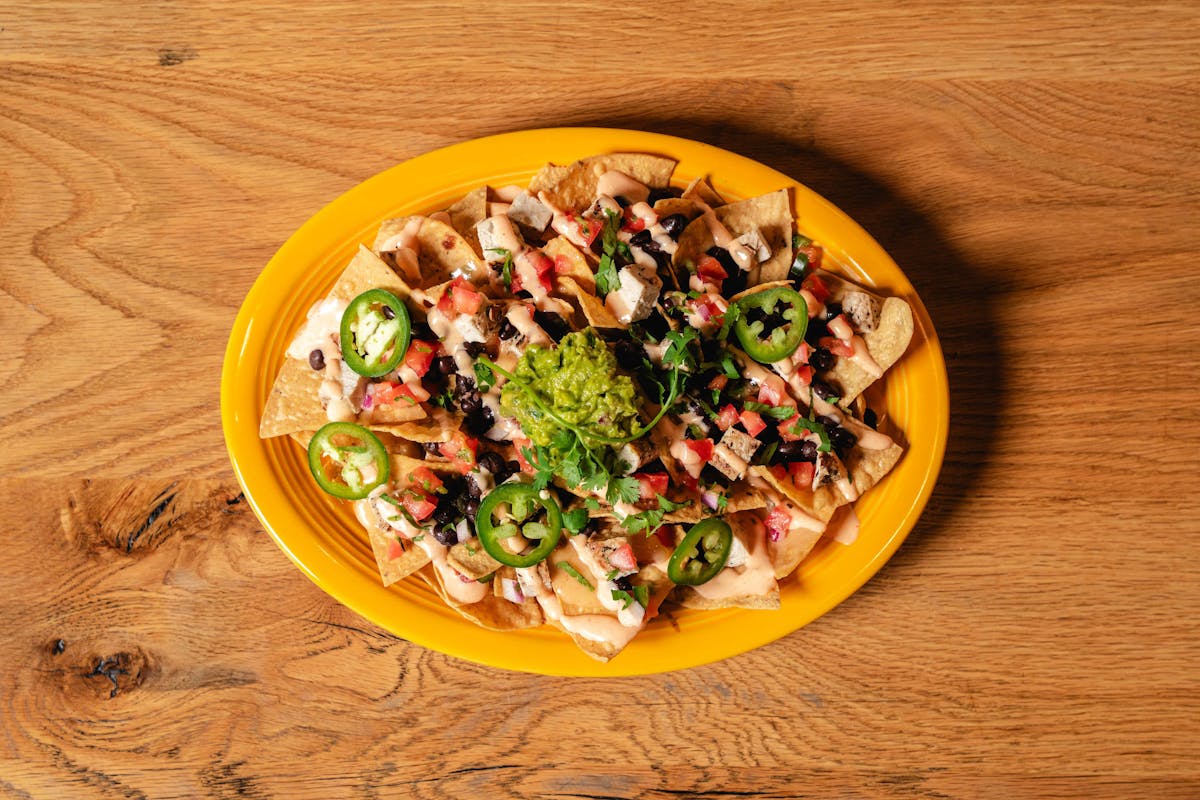 a plate of food sitting on top of a wooden table