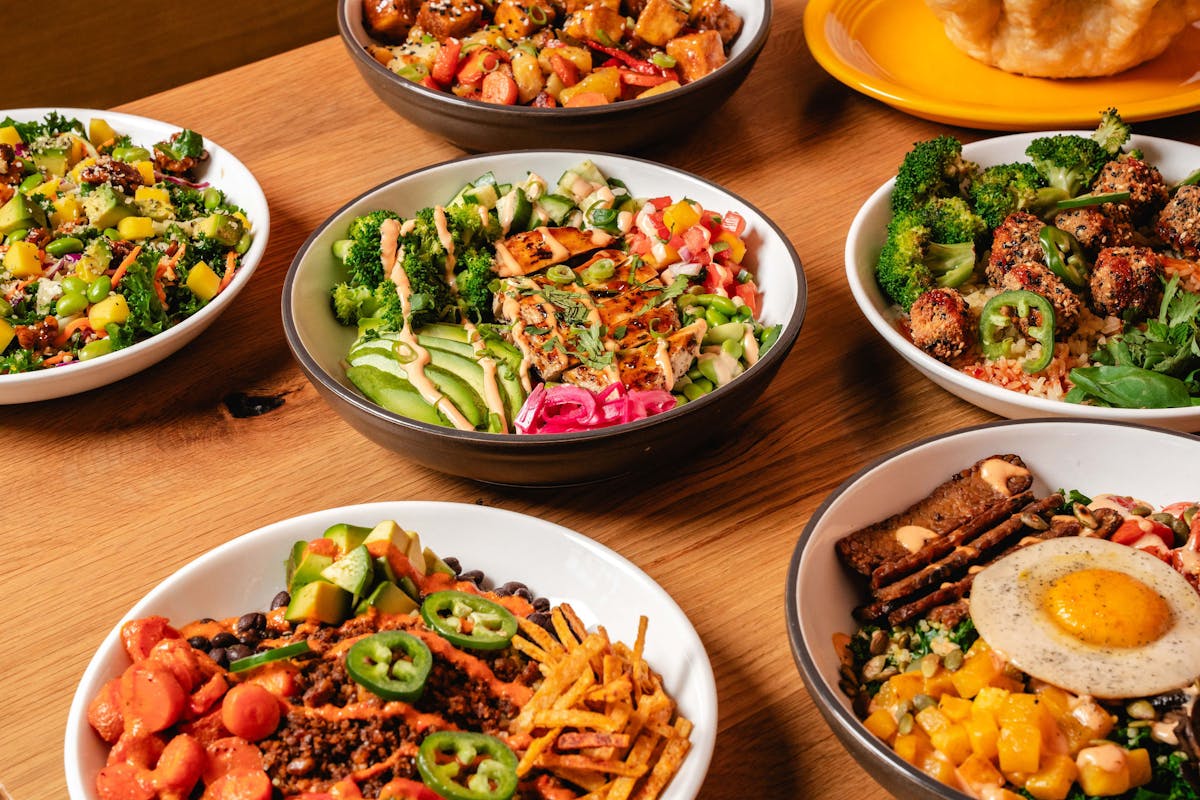 a bowl filled with different types of food on a table