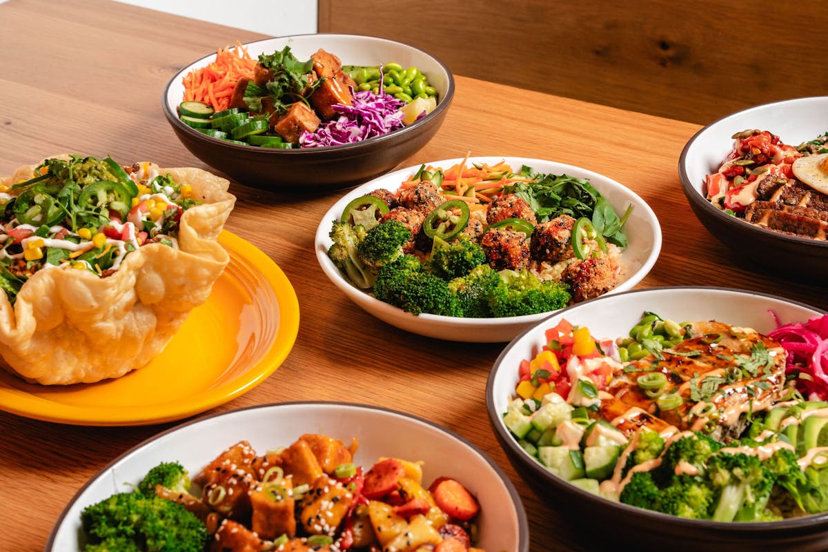 a bowl filled with different types of food on a table