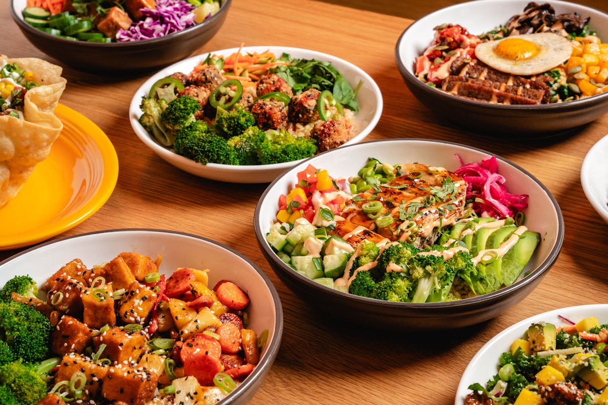 a bowl filled with different types of food on a table