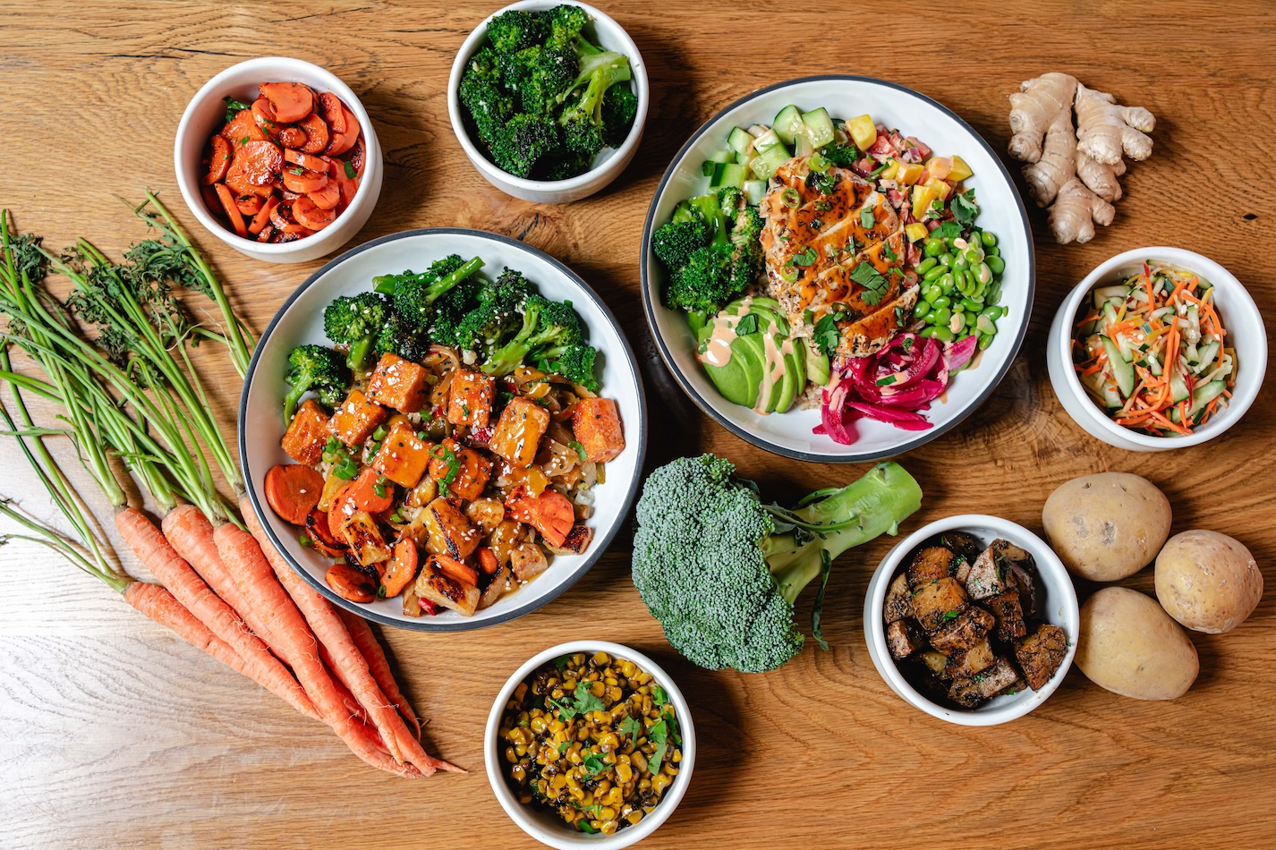 bowls of food with fresh vegetables