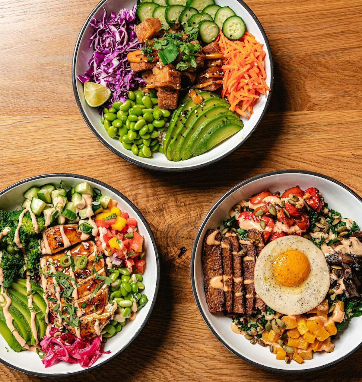 a bowl filled with different types of food on a table