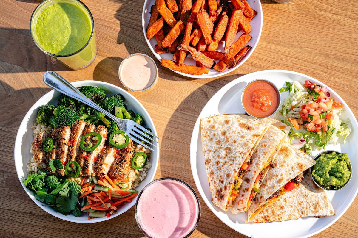 a bowl filled with different types of food on a table