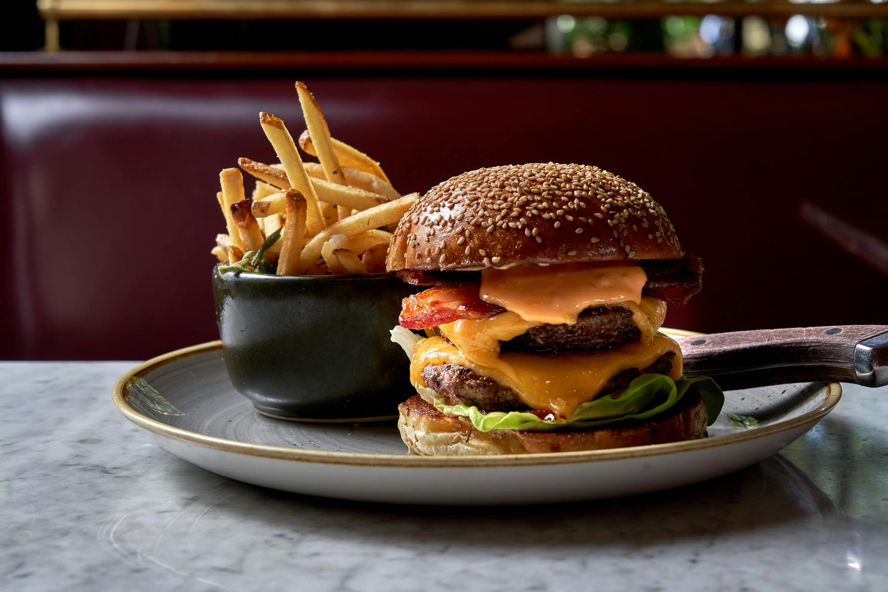 a hamburger and fries on a plate