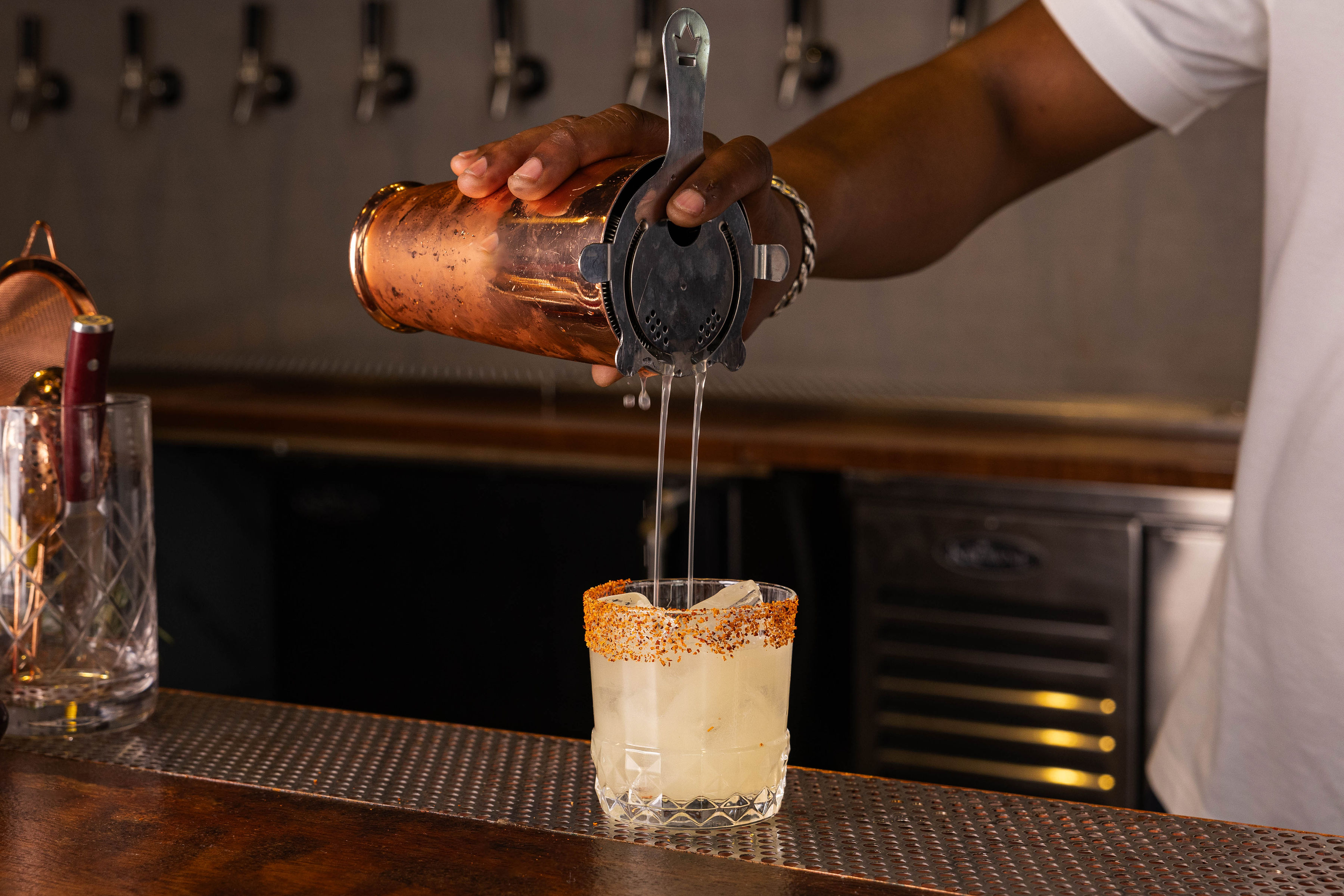 a person cutting a cake