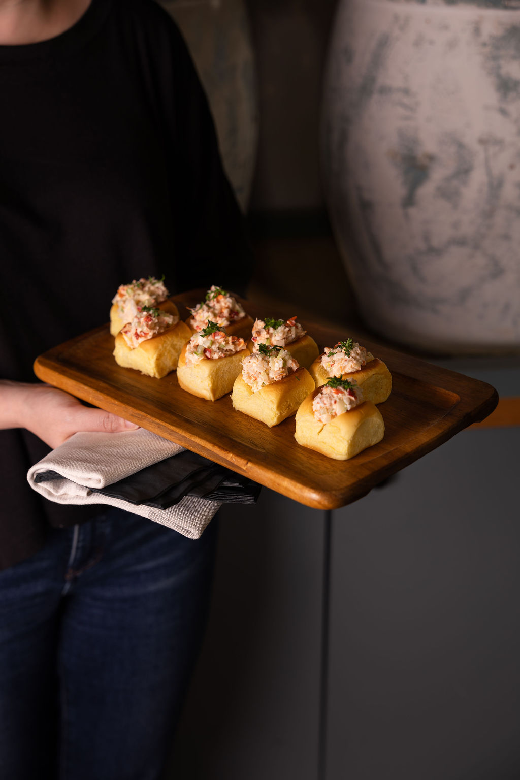 a person standing in front of a cake
