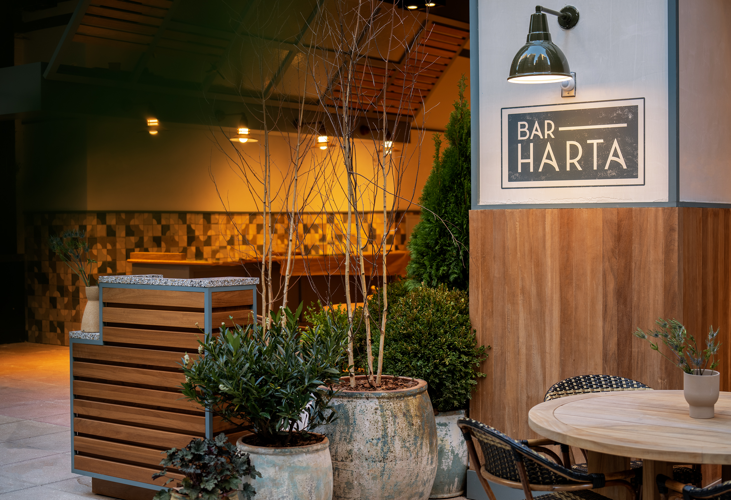 a table that has a sign on the side of a building