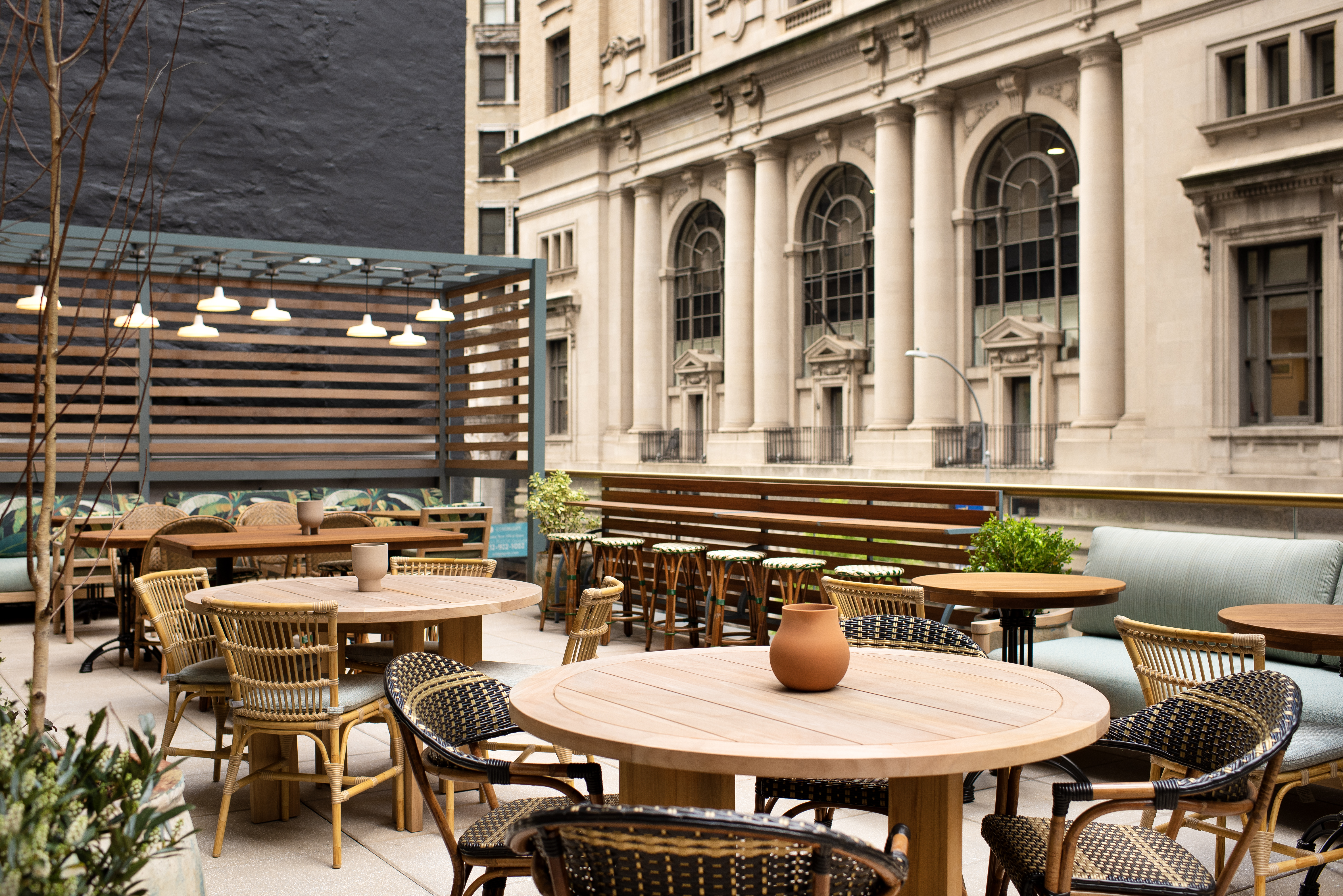 a dining table in front of a building