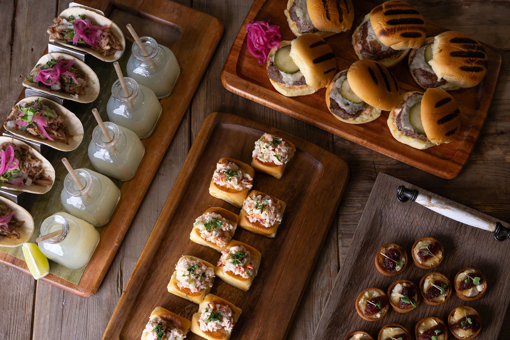 a bunch of food sitting on top of a wooden cutting board