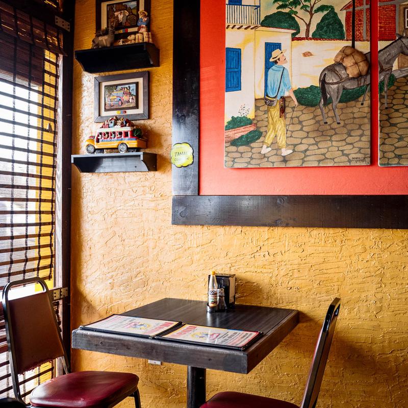 a room with a couch and table in a restaurant