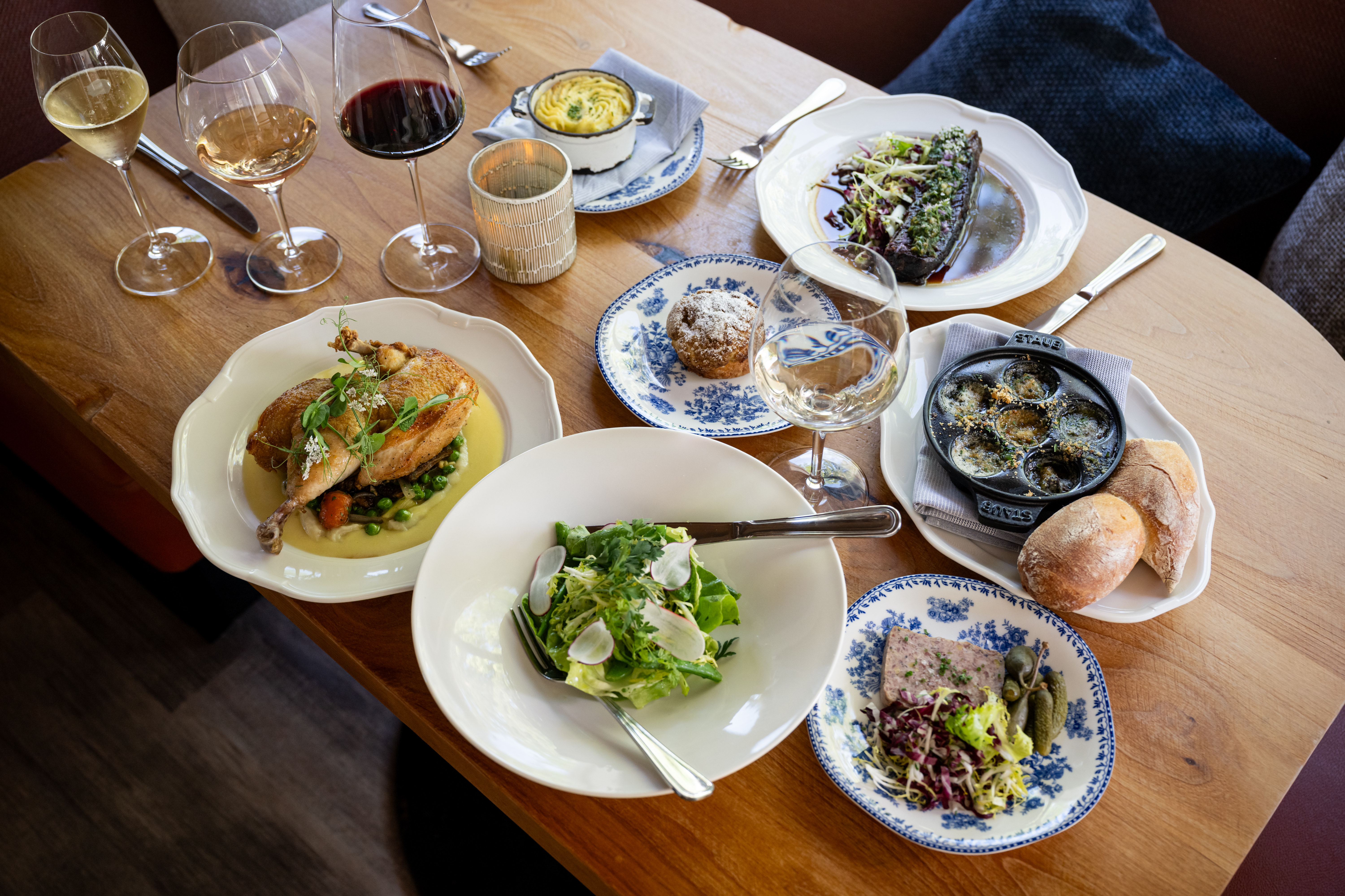 a plate of food sitting on top of a wooden table
