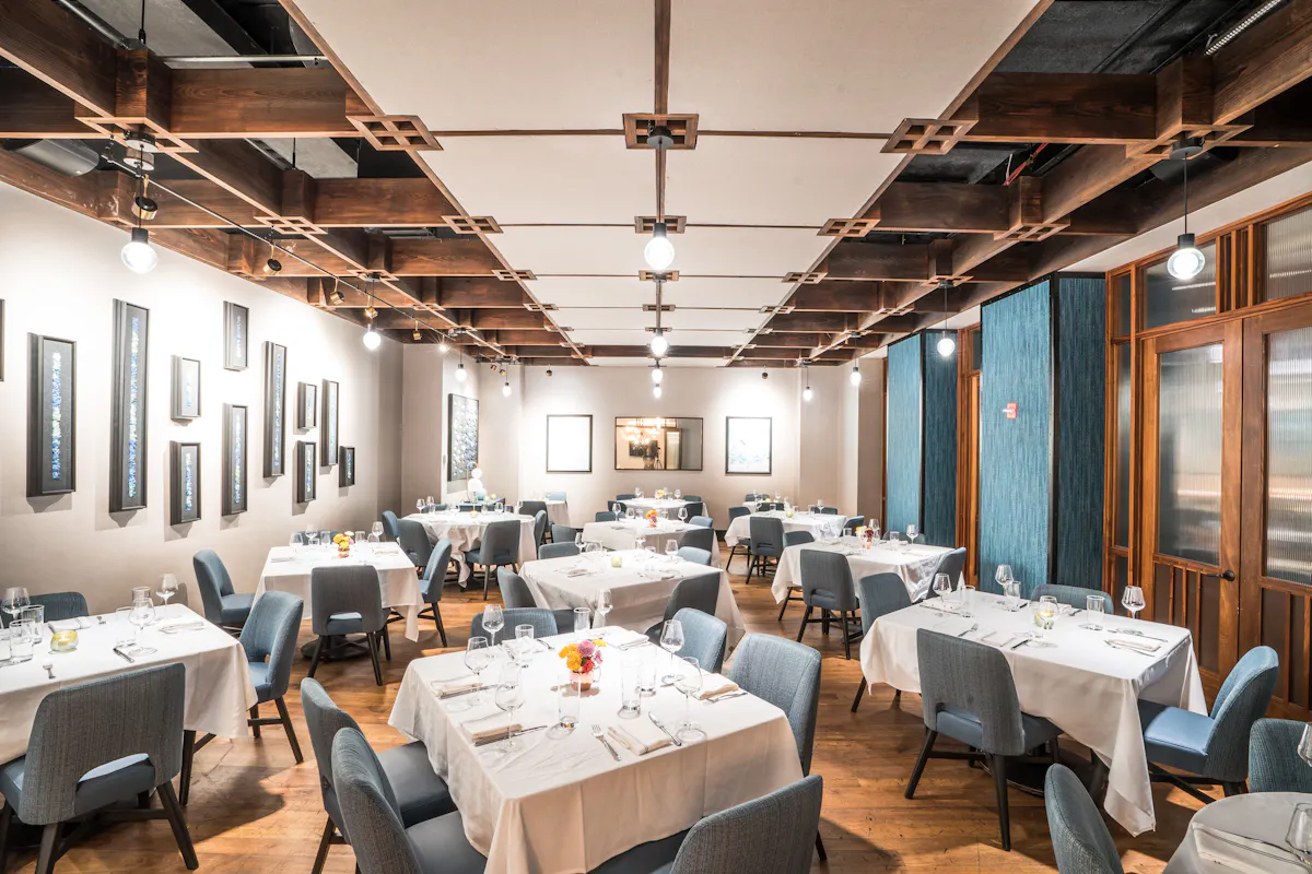 a room with a table and chairs