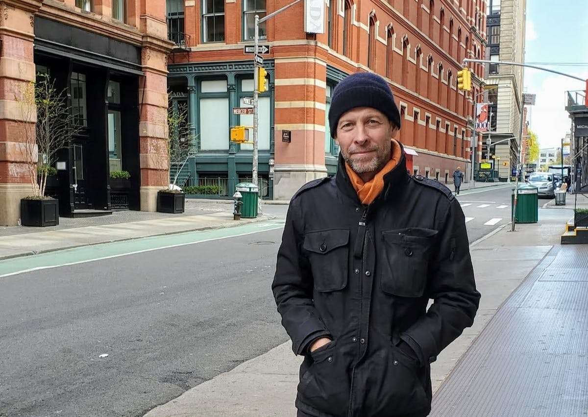 a person standing on a sidewalk