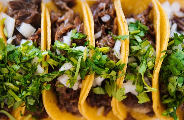 five beef tacos with cilantro