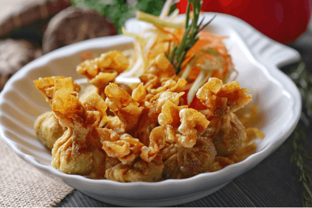 A plate of fried wontons