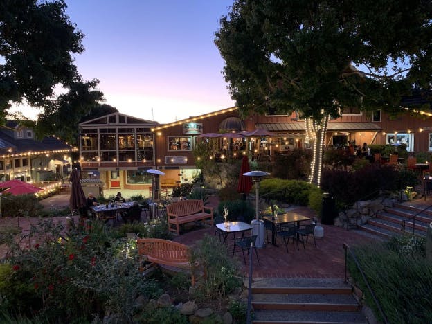 Lights illuminating the outdoor seating area of a restaurant
