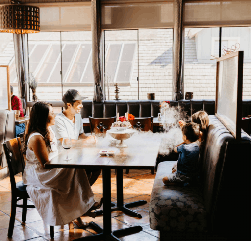 A family at a fine-dining restaurant in Carmel