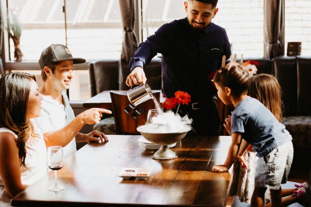 A family enjoying at a fine dining restaurant in Carmel