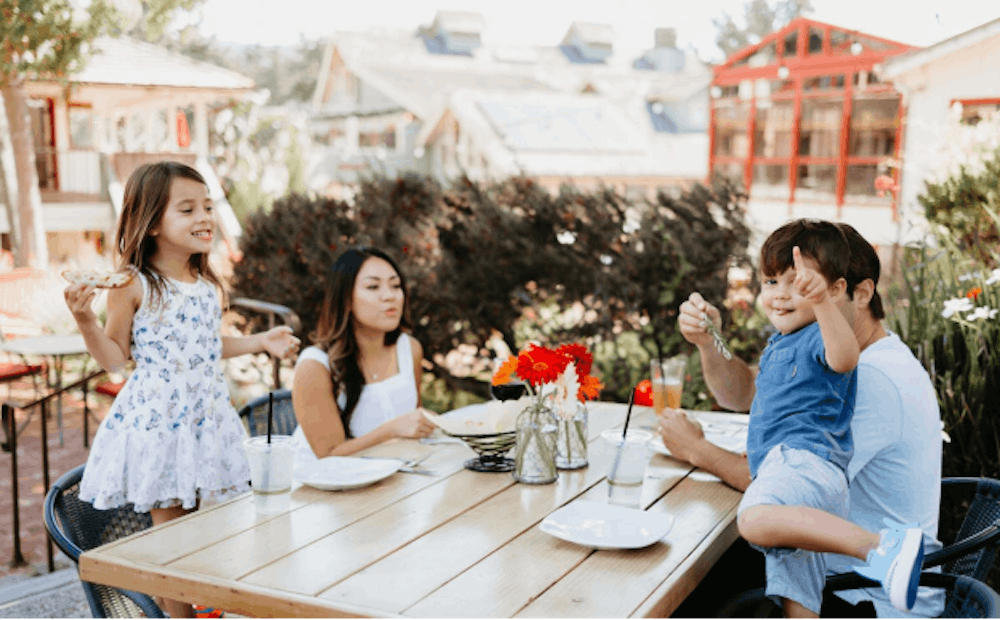 A family enjoying lunch at a restaurant in Carmel