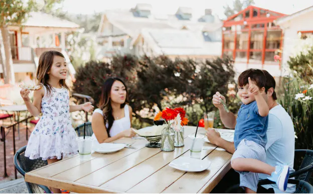 A family enjoying lunch at a restaurant in Carmel