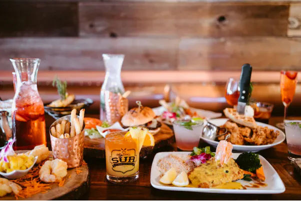 Seafood dishes and drinks served on a table