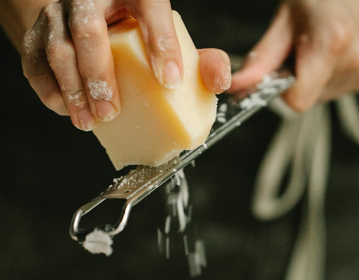 Block of cheese and grater
