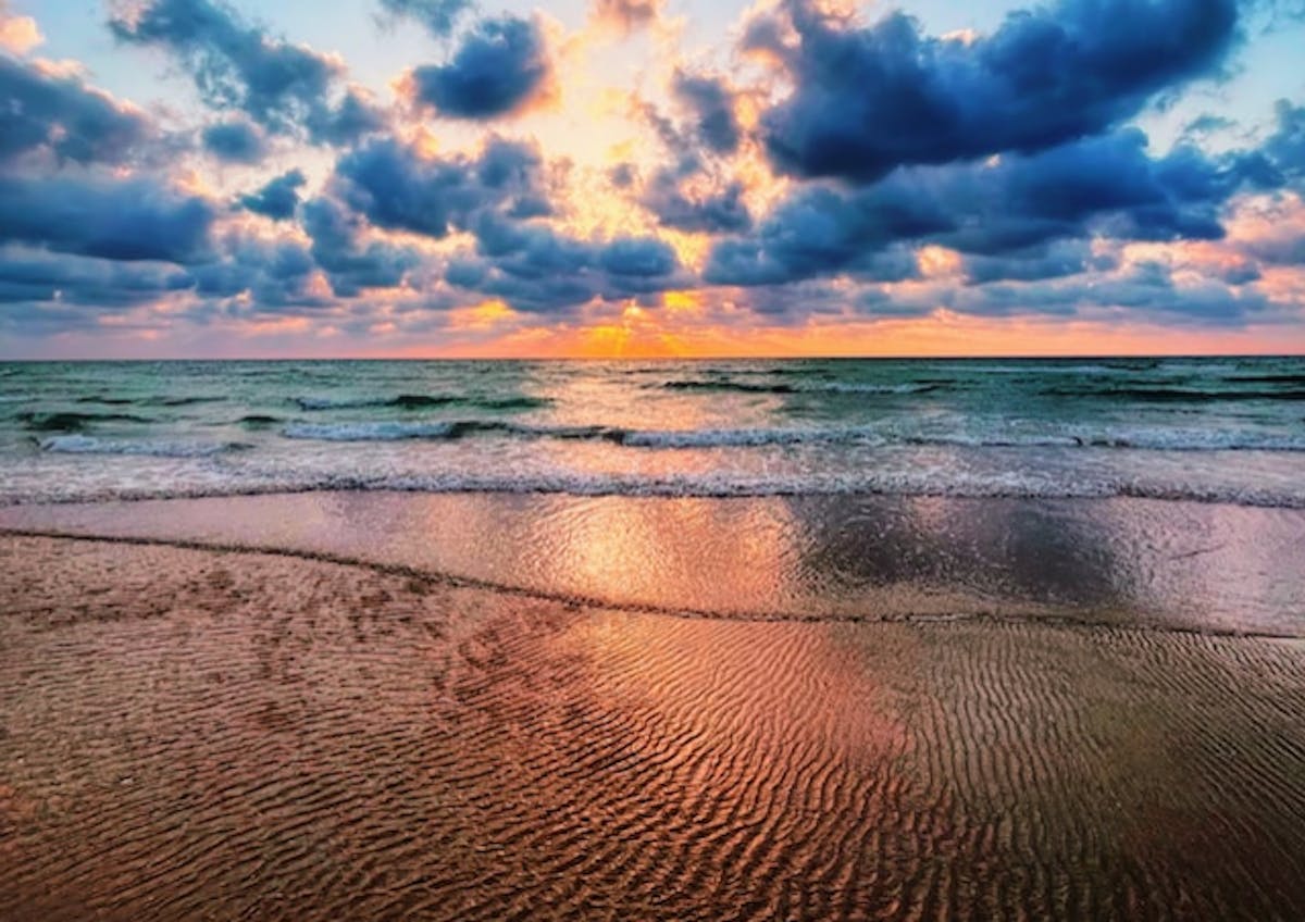 a sunset over a body of water