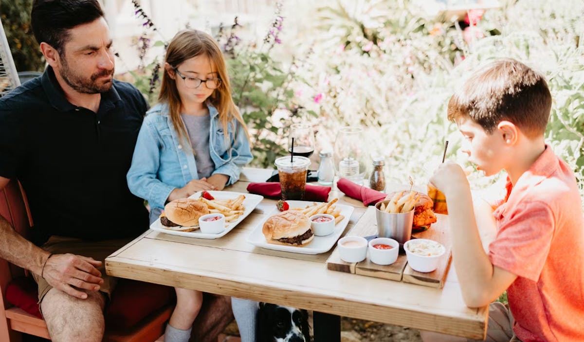 A family enjoying their meal at SUR