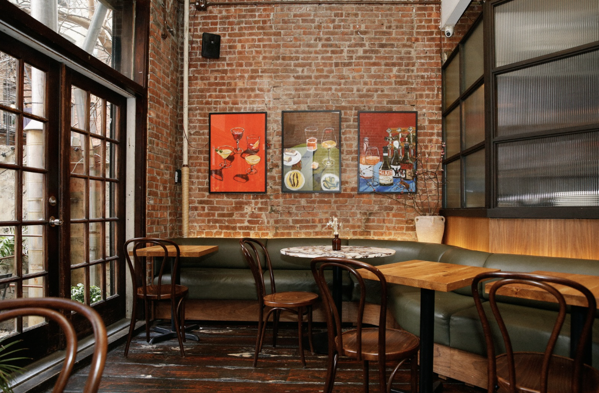a dining room table in front of a window