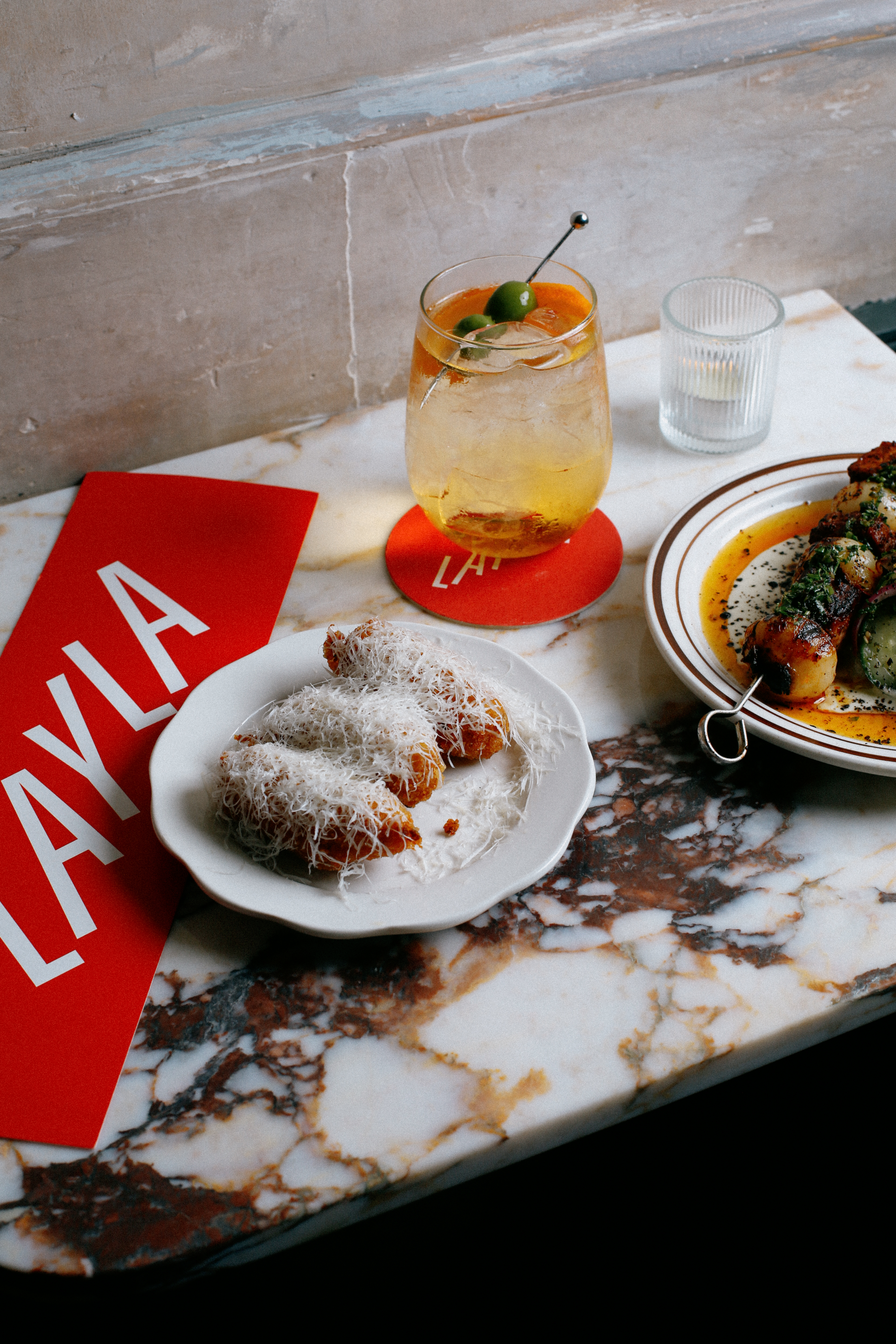 plates of food and a drink