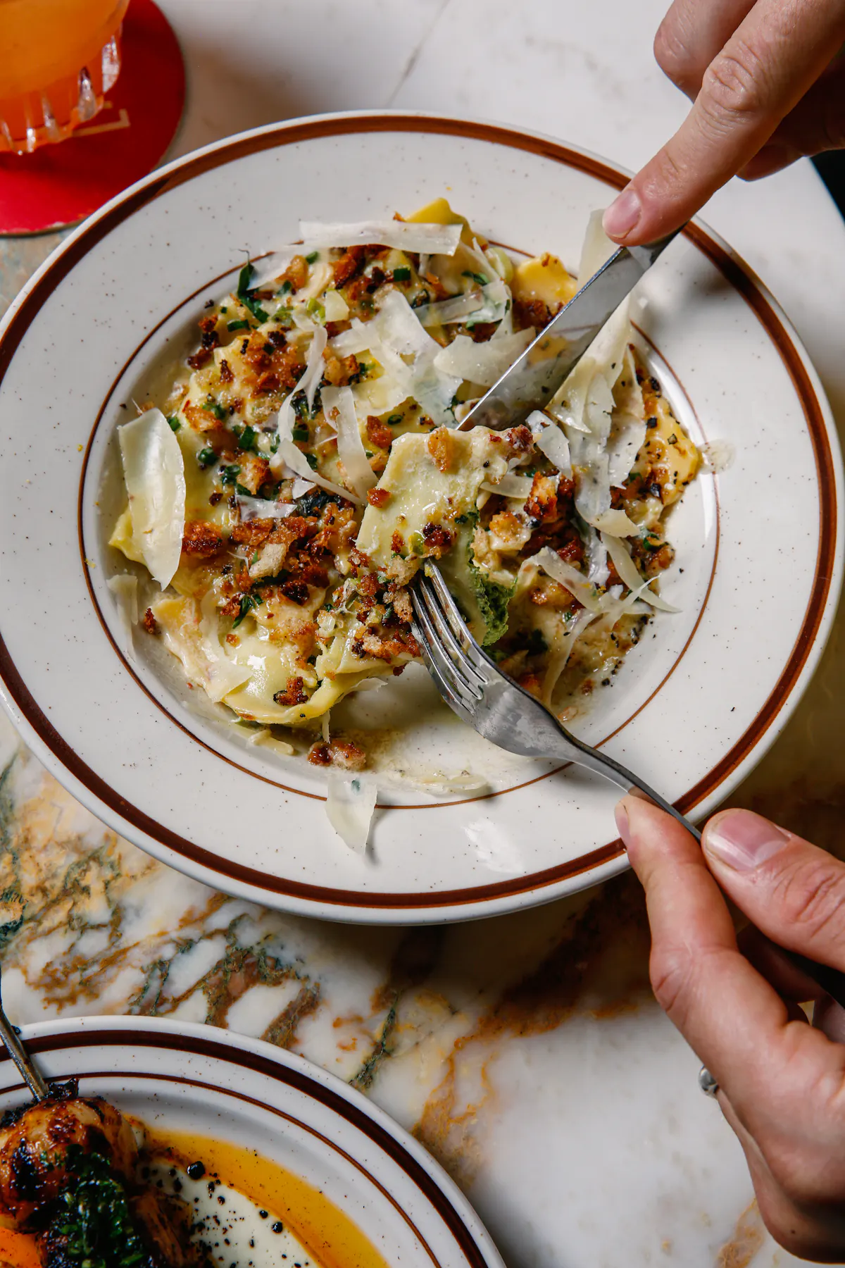 a person holding a plate of food