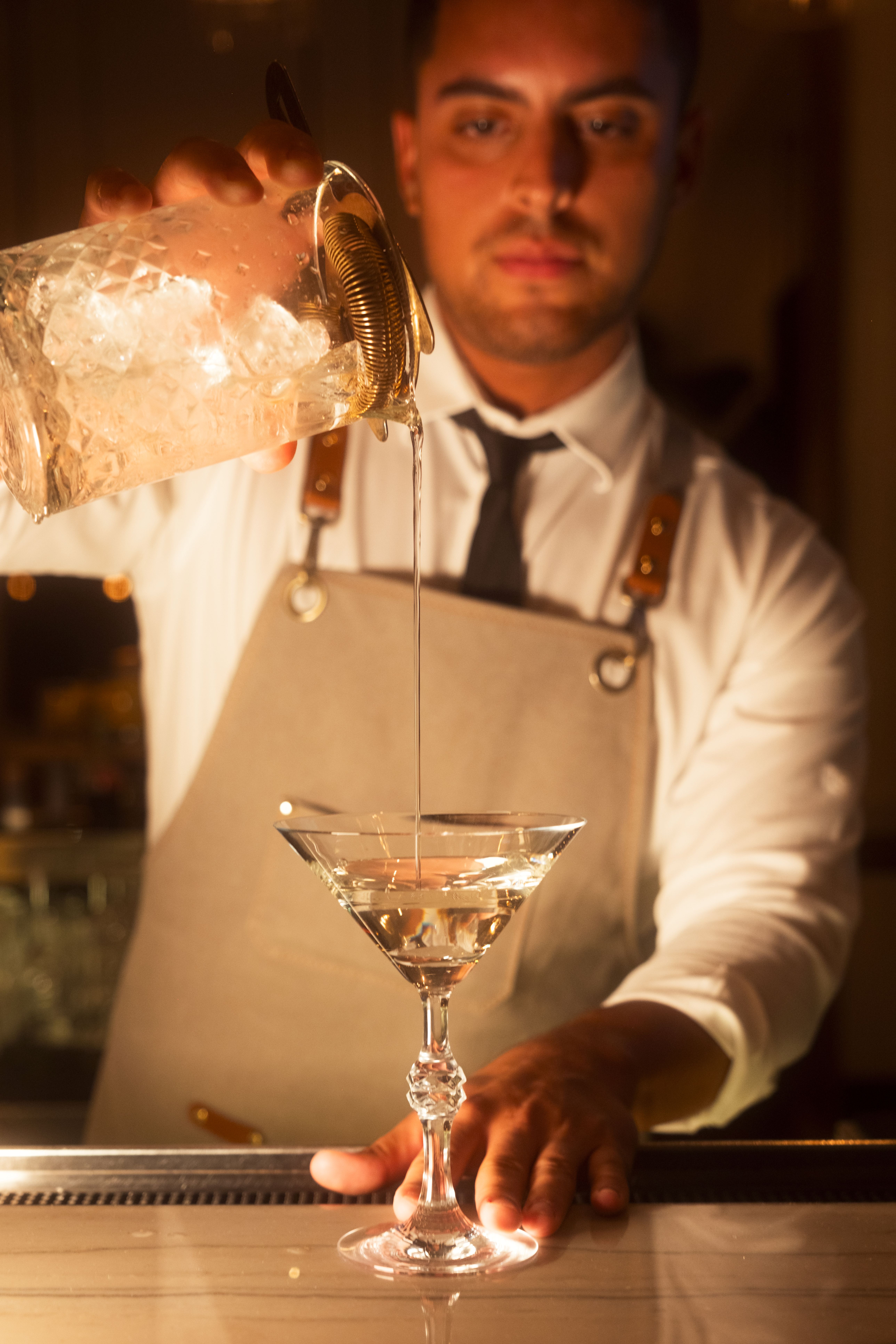 a person pouring a drink