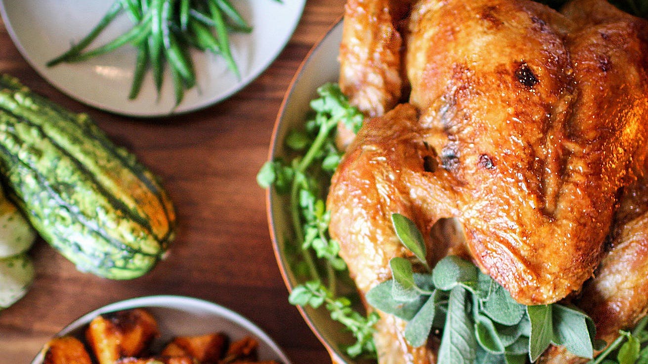 a plate of food with a turkey for thanksgiving