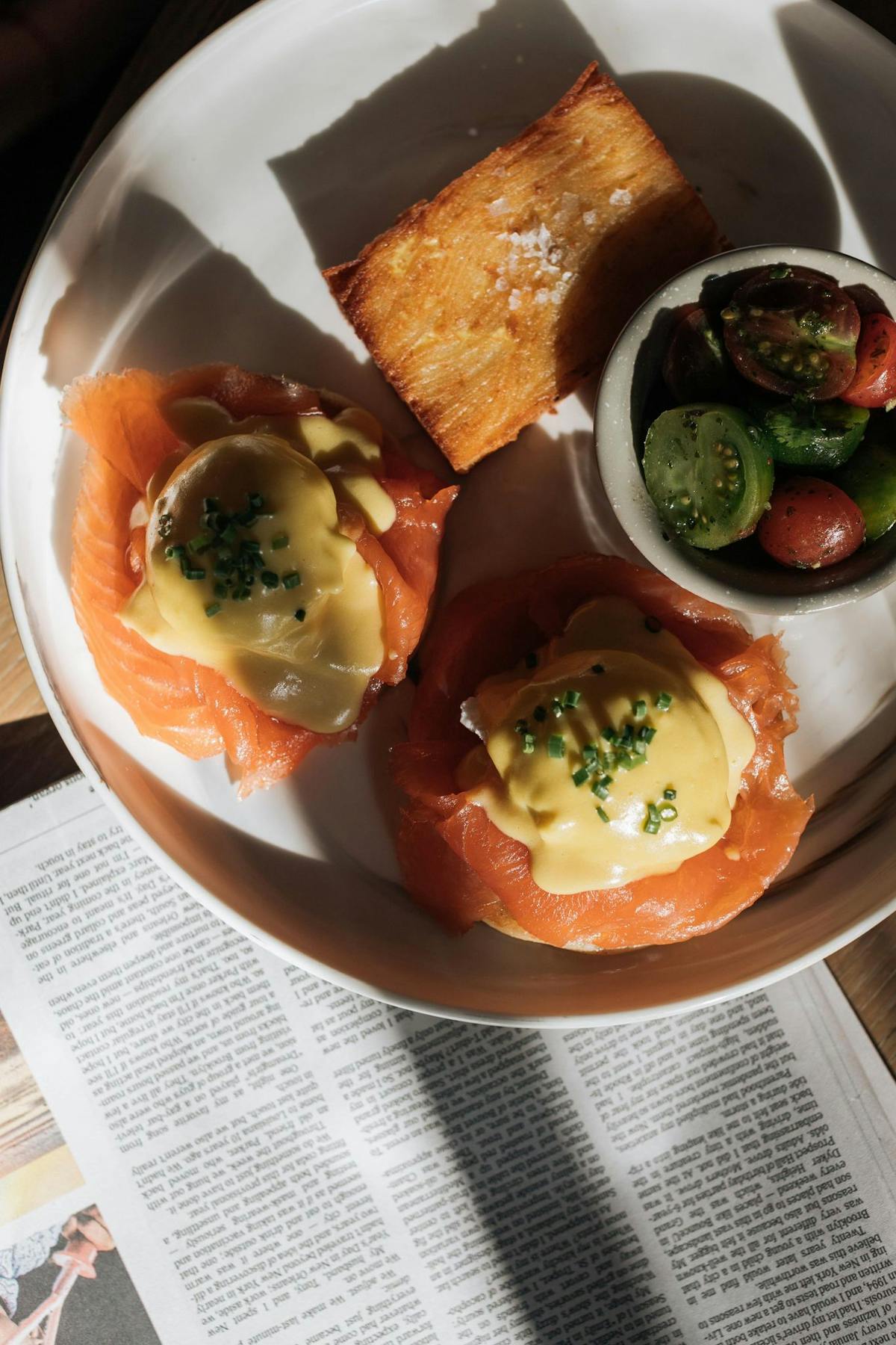 poached eggs on top of salmon on a plate at Edge Steak & Bar in Brickell, Miami