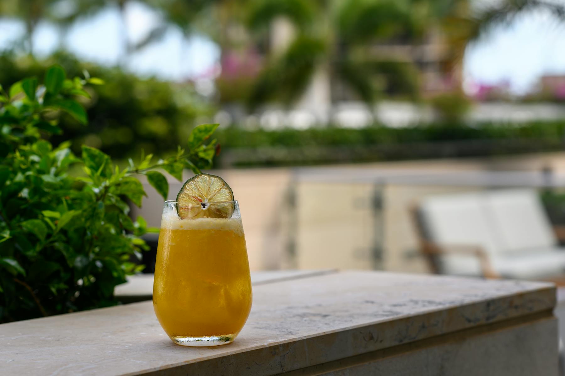 a cocktail sitting on top of a wooden table