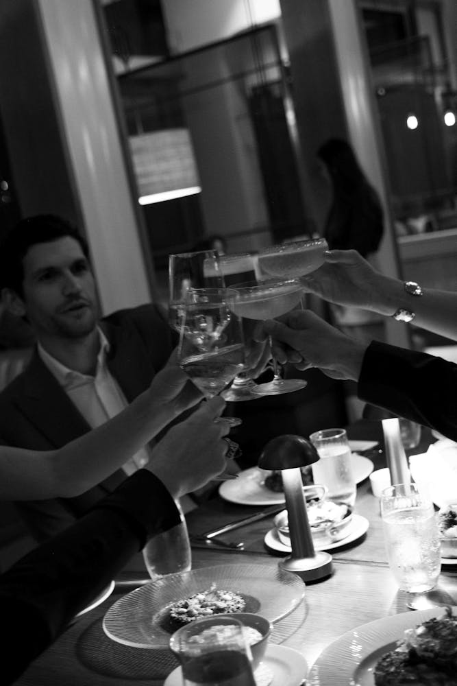 a group of people sitting at a table in a restaurant