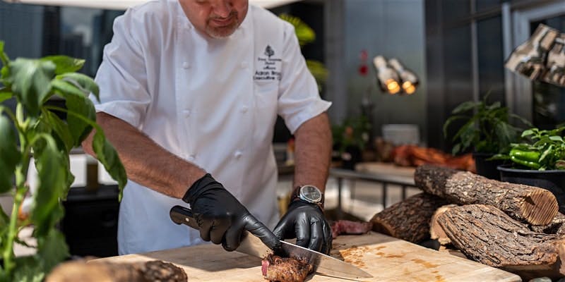a man cooking in a kitchen preparing food