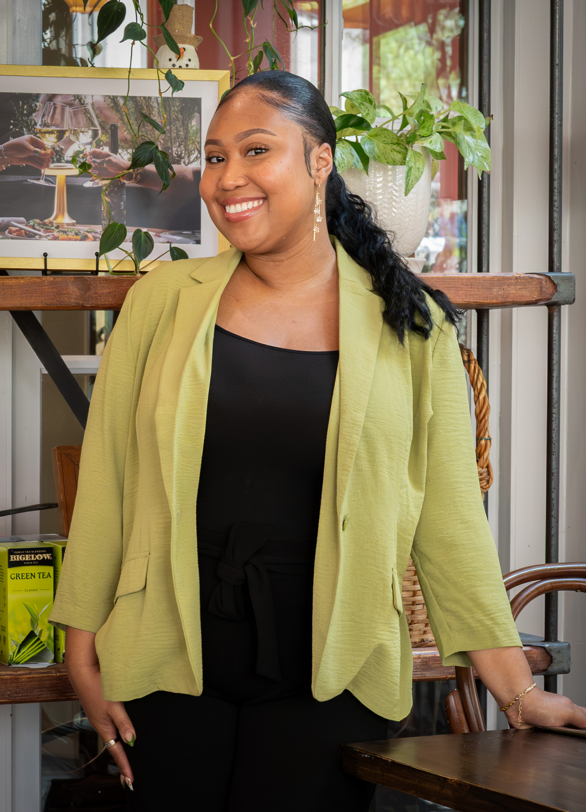 a woman standing in front of a window