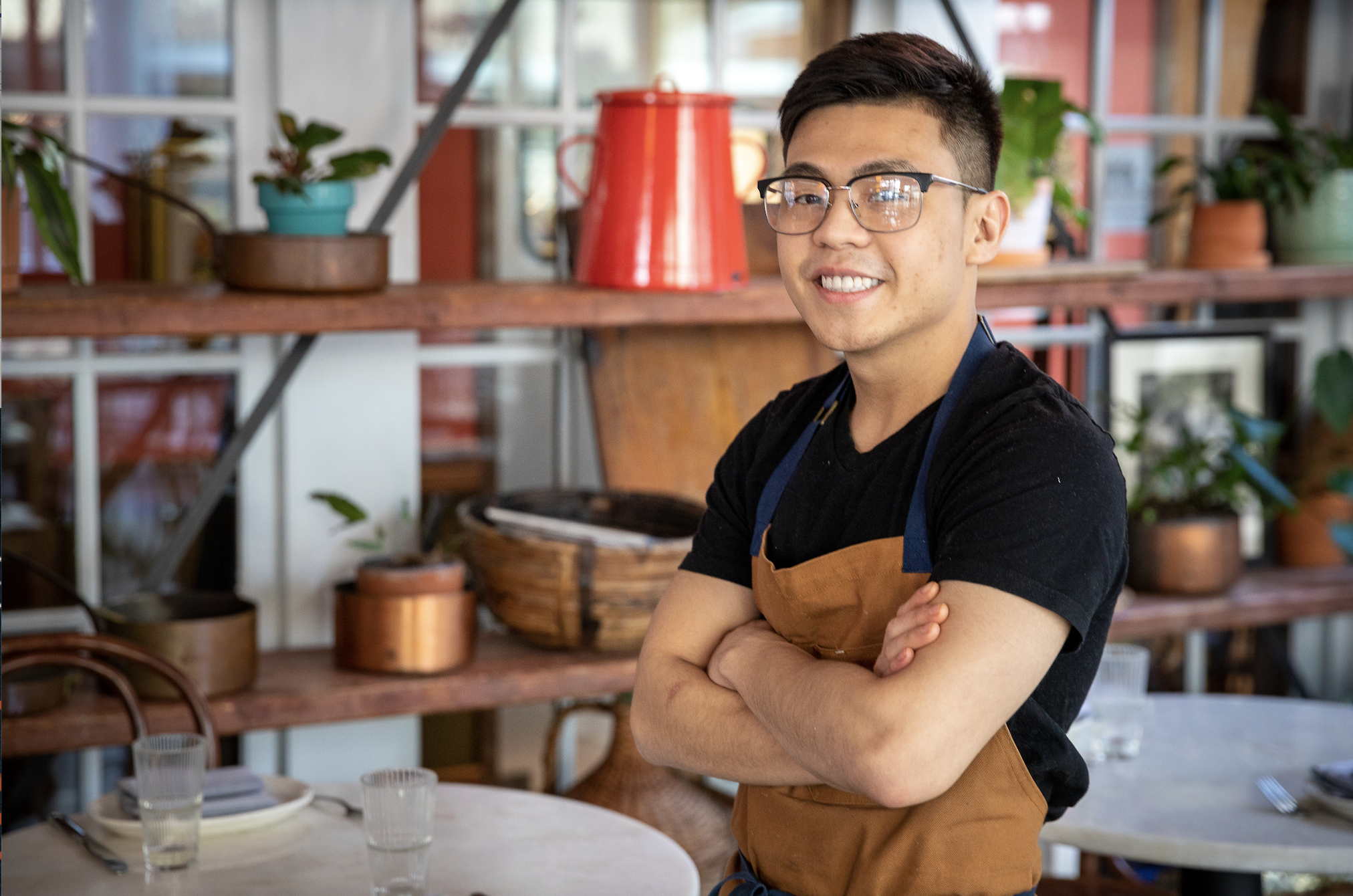 a man sitting at a table in a restaurant