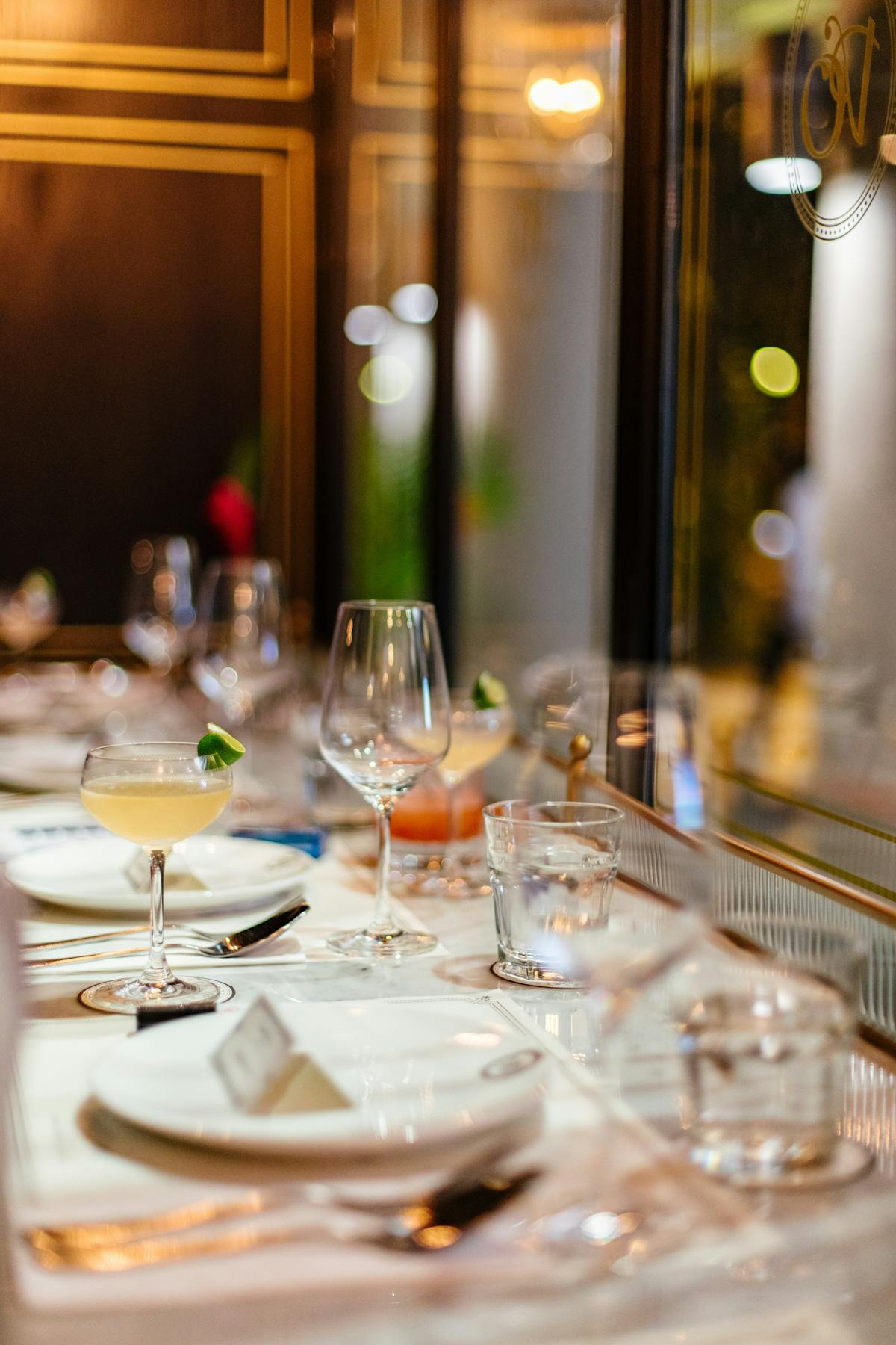 a dining table with wine glasses