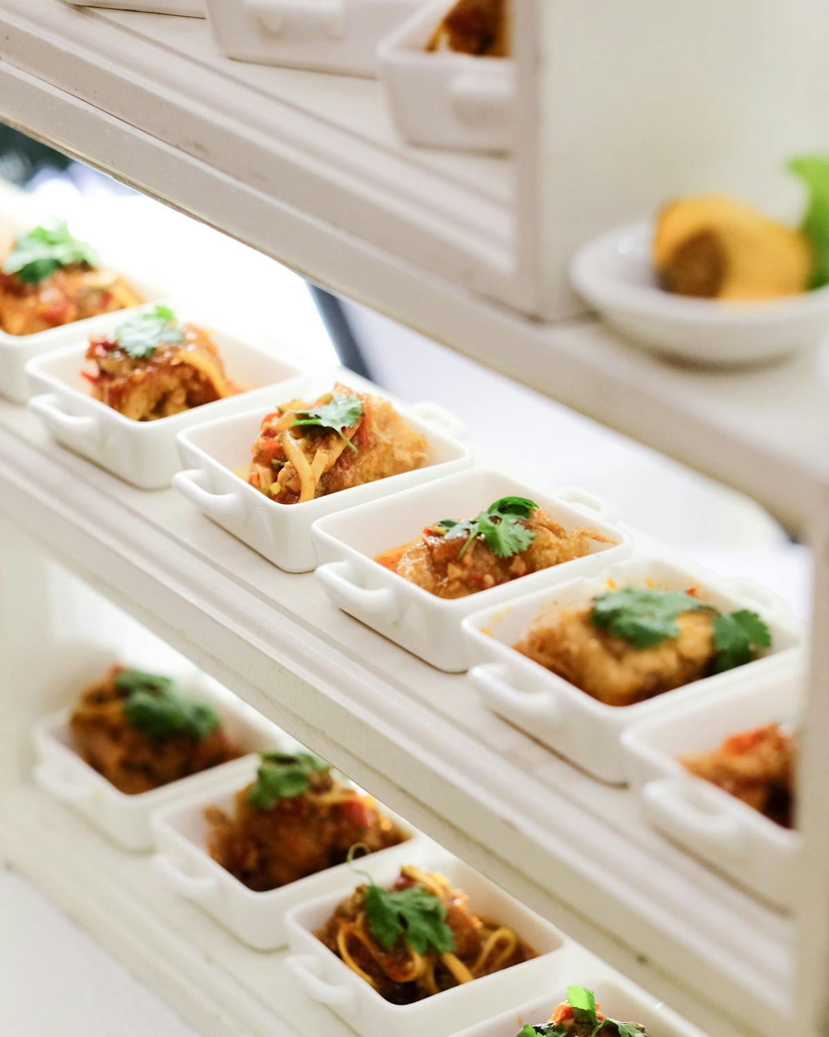 a bunch of food sitting on top of a refrigerator