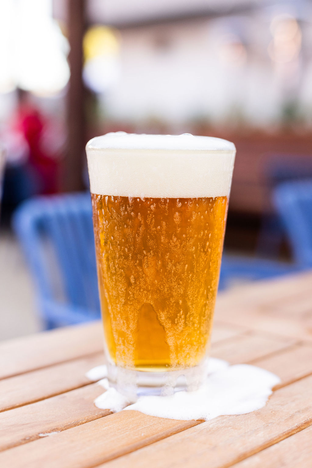 a close up of a glass of beer on a table