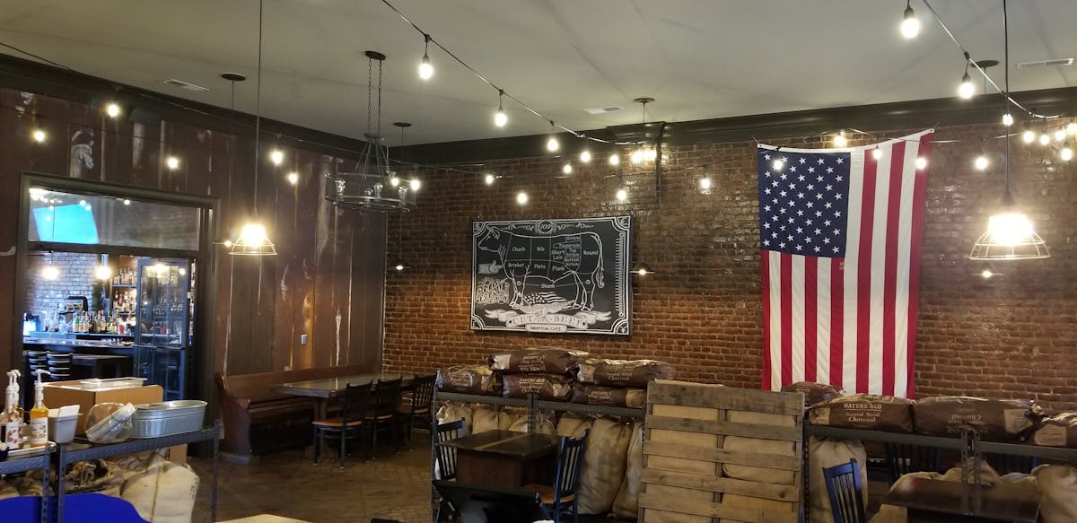 a room filled with furniture and a table in a restaurant