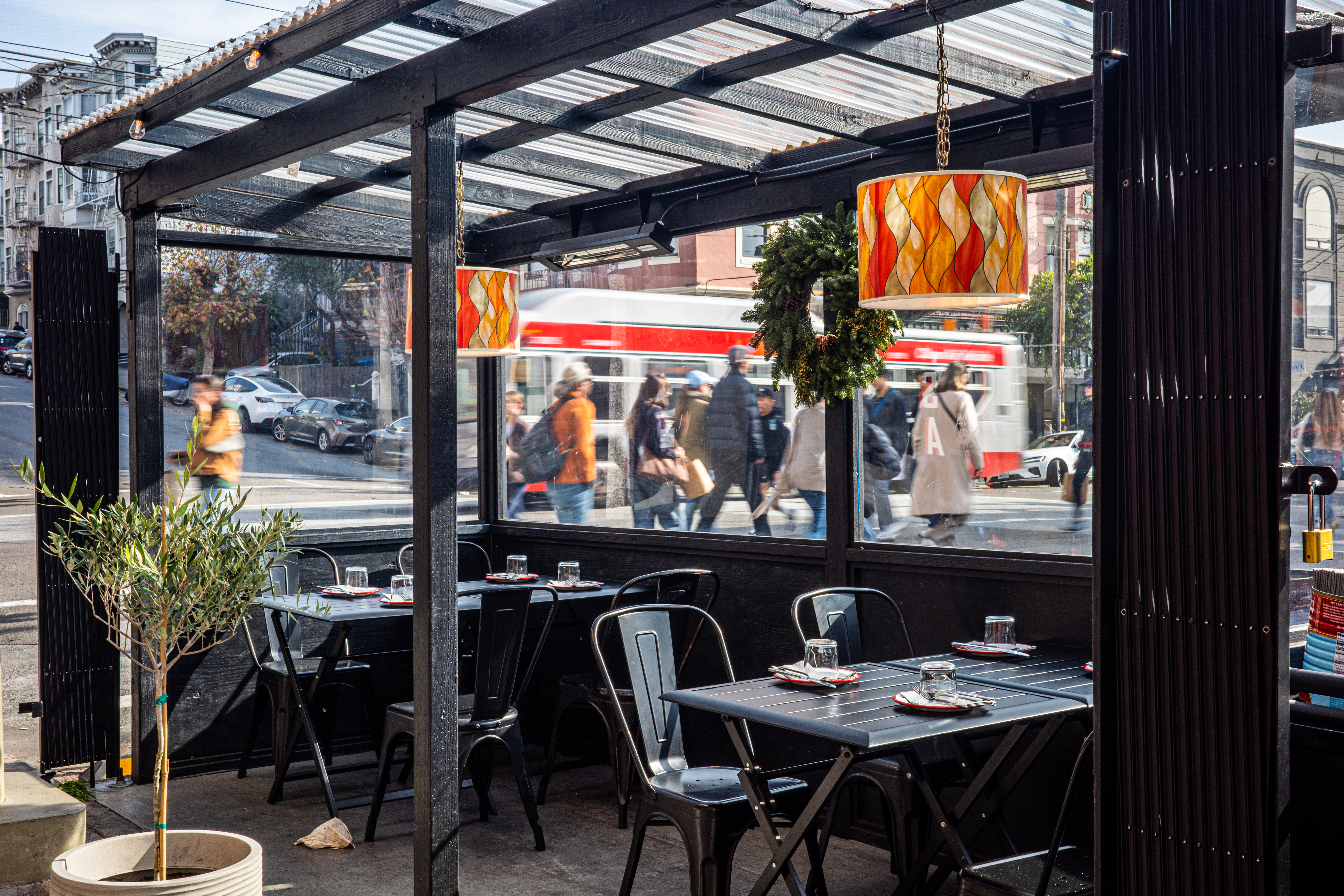 a person sitting at a table in a restaurant