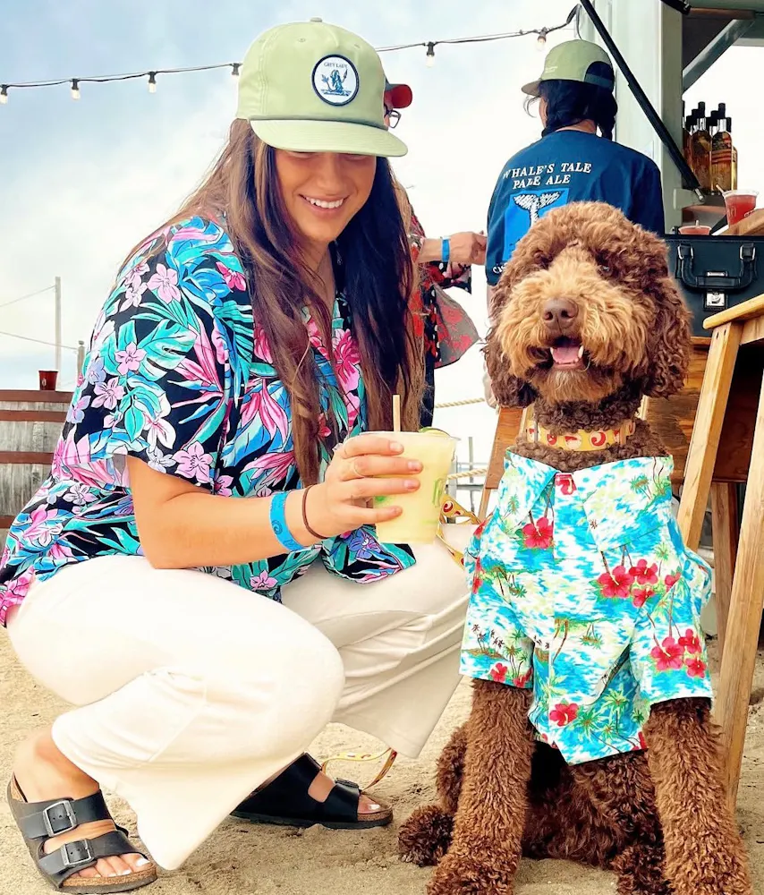 a woman and dog with drinks