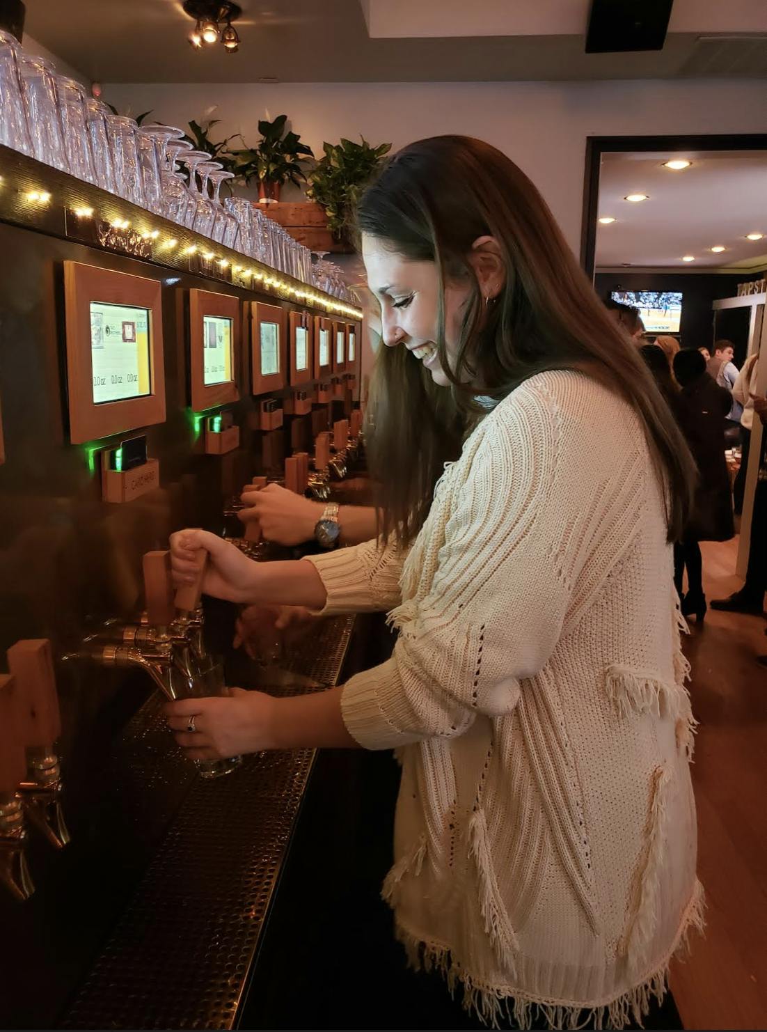 a woman serving herself a glass o